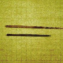 [Two Assorted Ear Wax Remover Spoons]